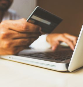 person paying online with credit card