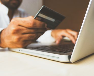 person paying online with credit card