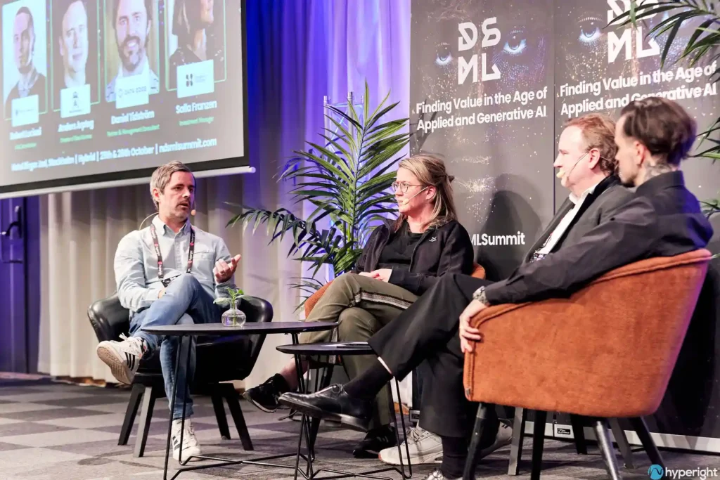 Moderator and panelists during a panel discussion at the Nordic Data Science and Machine Learning NDSML Summit 2023 in Stockholm